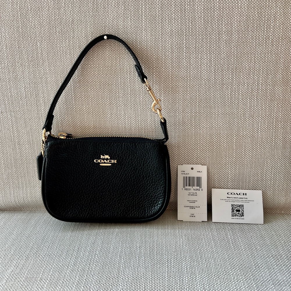 Coach Nolita 15, black pebbled leather wristlet/pouch. 6L x 4H x 1.5D.